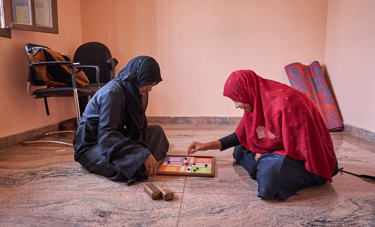 Two women playing chess in the centre